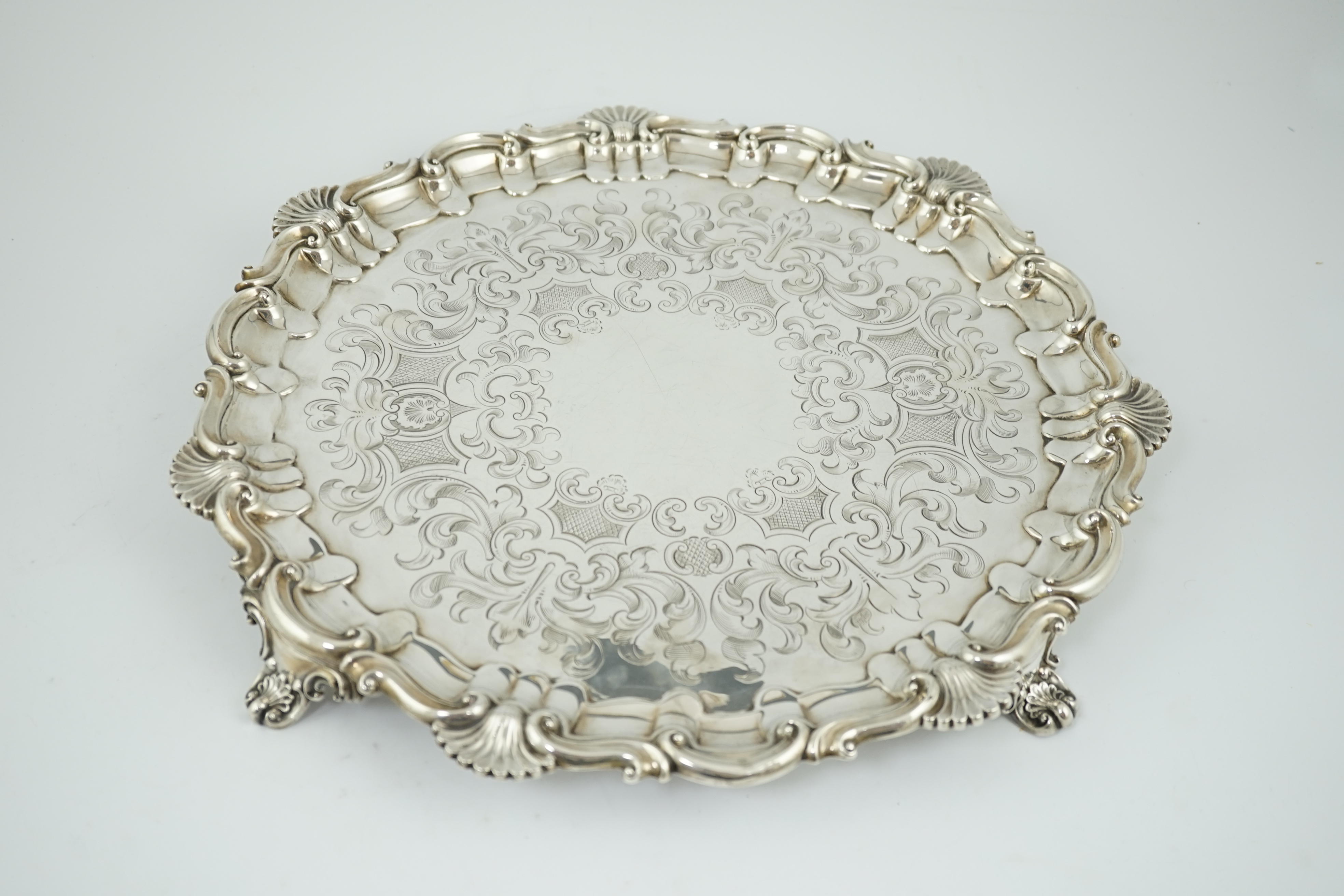 A large Victorian engraved silver salver, by Henry Wilkinson & Co